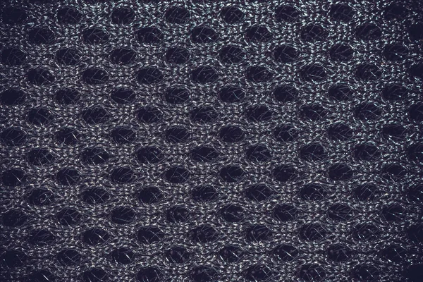 Hücrelerin desen arka planına sahip sentetik kumaş.