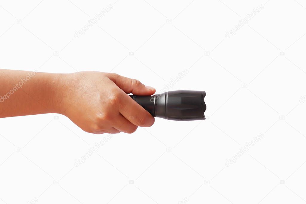 Black flashlight in human hands, isolated on a white background with the clipping path.