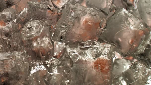 Dramatic Slow Motion Macro Shot Pouring Whiskey Glass Ice Cubes — Stock Video