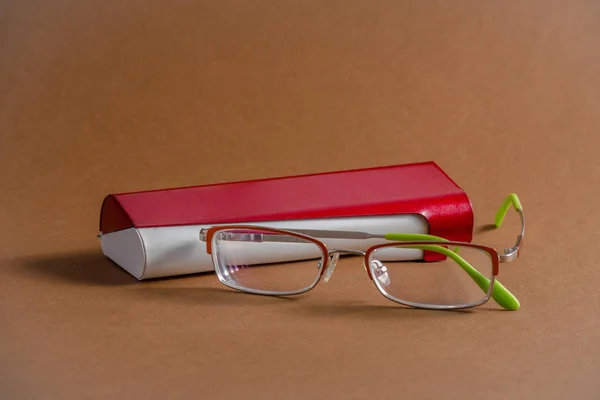 Glasses with red metal case