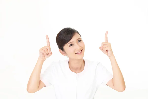 Smiling Beauty Expert Pointing Her Fingers — Stock Photo, Image