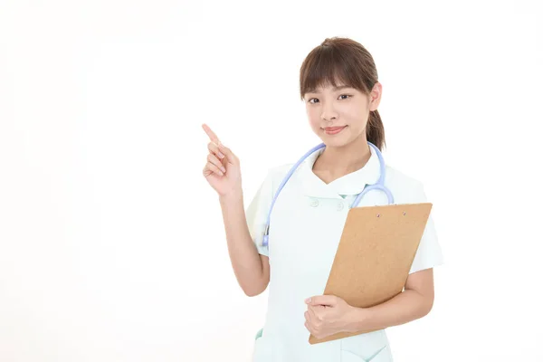 Young Female Nurse Pointing — Stock Photo, Image