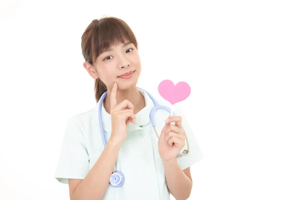 Smiling Asian Nurse Pink Heart Love Symbol — Stock Photo, Image