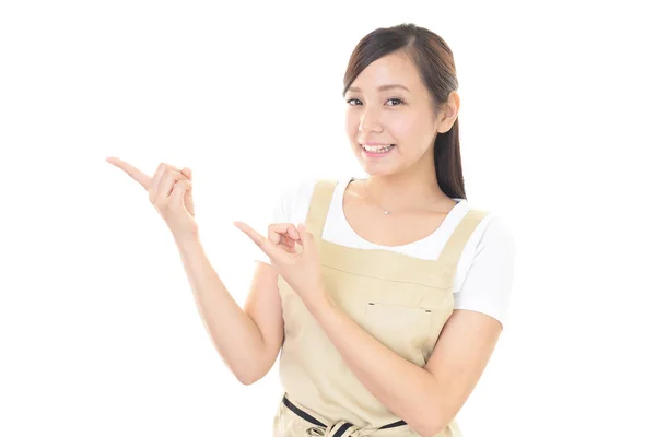 Smiling Asian Housewife Pointing — Stock Photo, Image