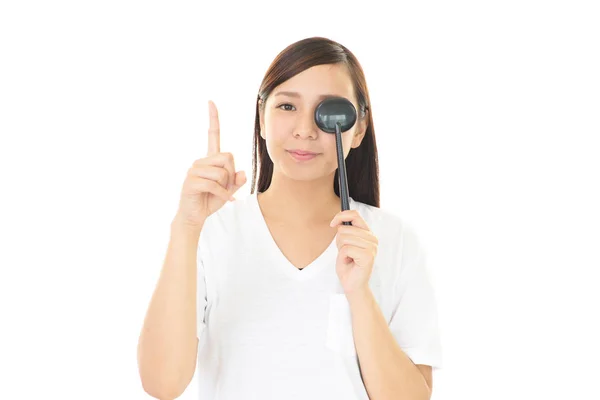 Woman taking an eye test