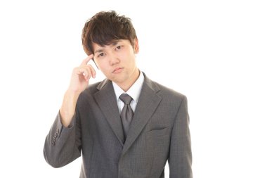 Huzursuz görünen bir iş adamı portresi