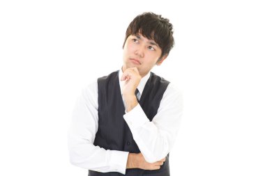 Huzursuz görünen bir iş adamı portresi.