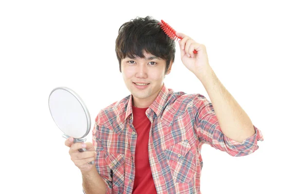 Man Brushing His Hair — Stock Photo, Image