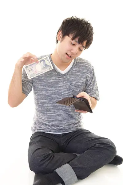 Enttäuschte Asiatische Mann Mit Geld Isoliert Auf Weißem Hintergrund — Stockfoto