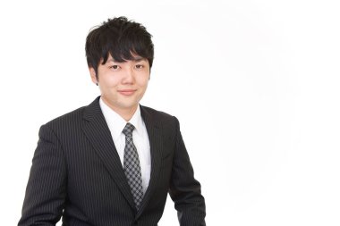 Gülümseyen Asyalı işadamı beyaz arka planda izole edilmiş