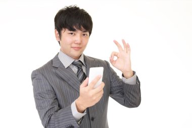 ok el işareti ile işadamı