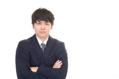 Beyaz arka plan üzerinde izole memnun Asya iş adamı