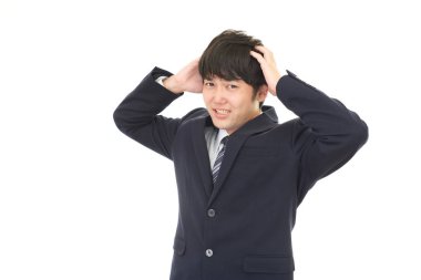 Beyaz arka plan üzerinde izole sinirli Asya iş adamı