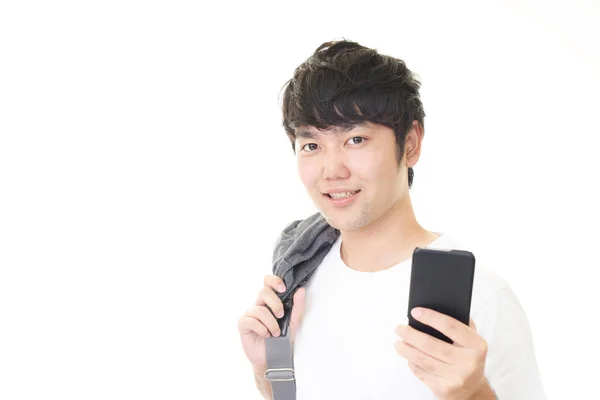 Hombre Asiático Sosteniendo Teléfono Inteligente —  Fotos de Stock