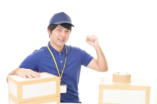 Smiling Delivery Man Packages — Stock Photo, Image