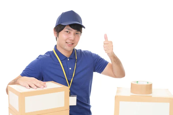 Smiling Delivery Man Packages — Stock Photo, Image