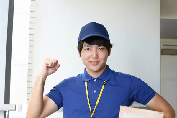 Smiling Delivery Man Packages — Stock Photo, Image