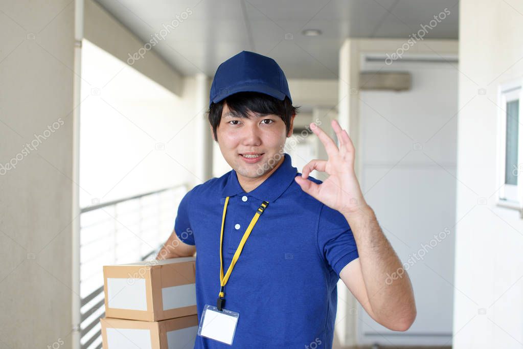 Smiling delivery man with packages