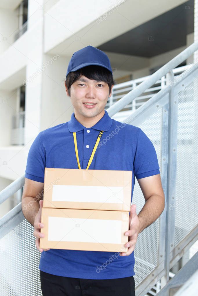 Smiling delivery man with packages