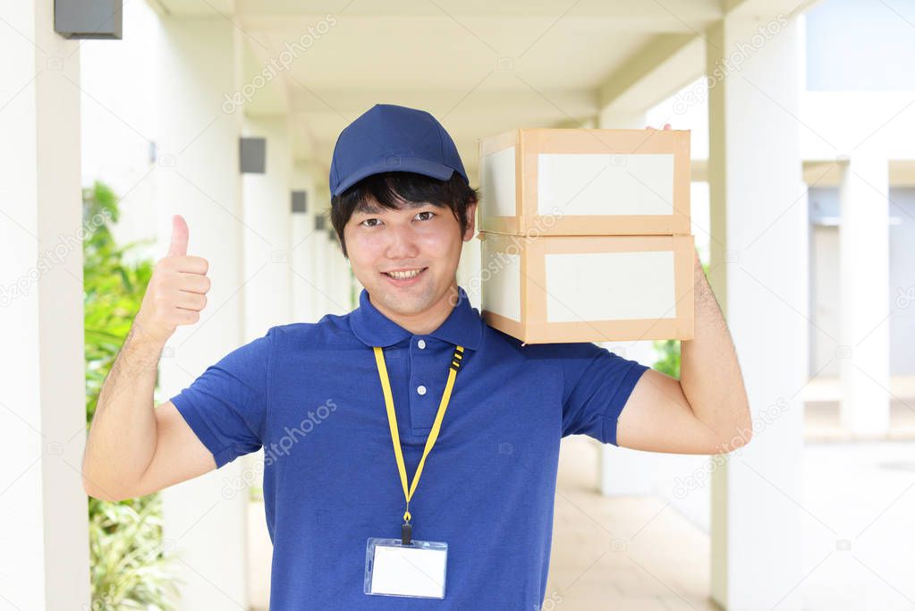 Asian courier delivering packages