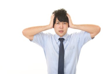 Beyaz arka plan üzerinde izole sinirli Asya iş adamı