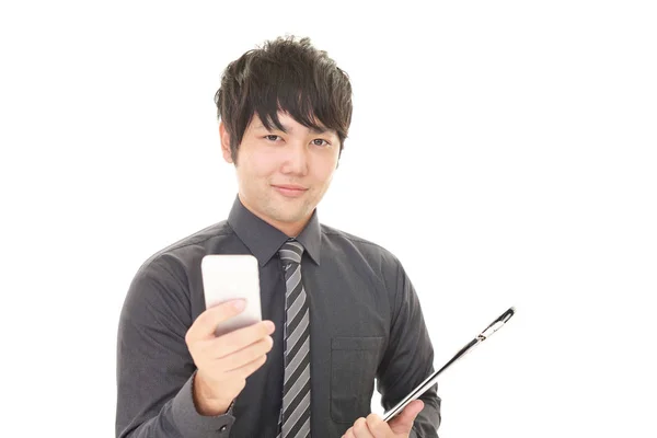 Businessman Holding Smart Phone — Stock Photo, Image