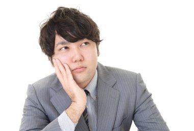 yorgun ve stresli Asya iş adamı