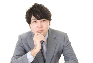 Huzursuz görünen bir iş adamı portresi