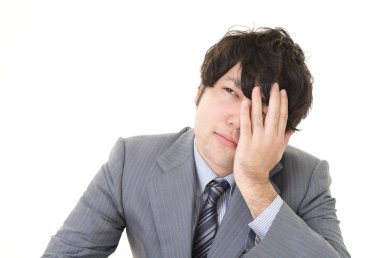 yorgun ve stresli Asya iş adamı