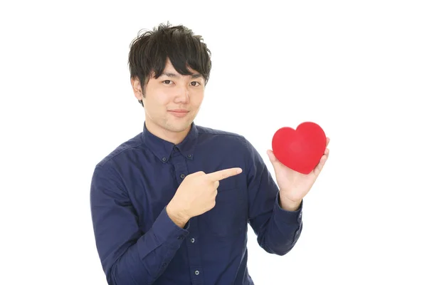 Sorrindo Homem Segurando Símbolo Amor Coração Vermelho — Fotografia de Stock