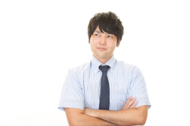 Asyalı işadamı kollarını kavuşturdu.