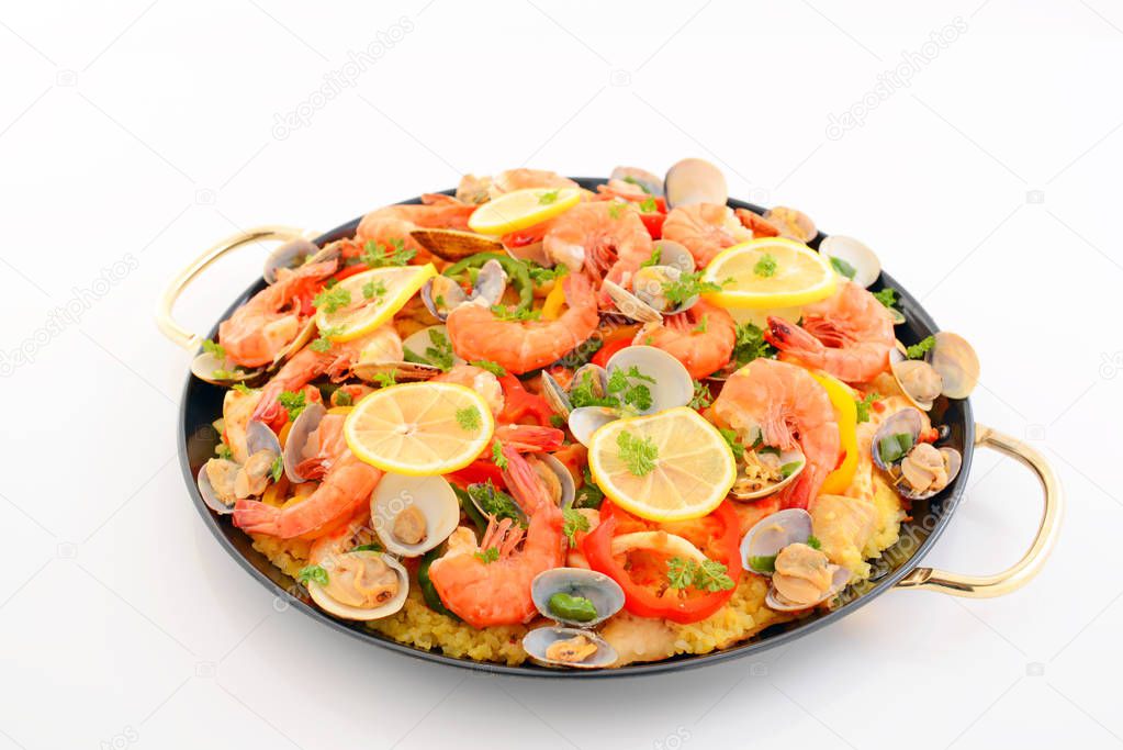 Delicious paella with seafood in a frying pan