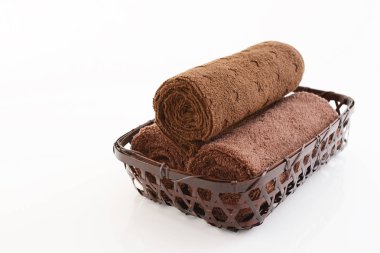 Rolled up towels in a basket clipart