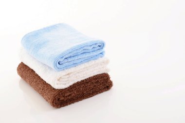 Colorful cotton towels isolated on white background clipart
