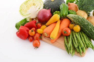 Mixed fresh vegetables on white background