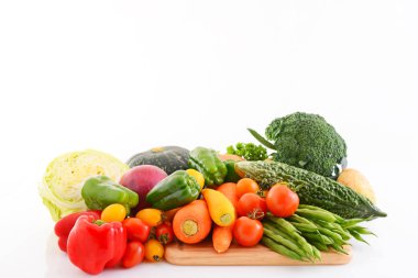 Mixed fresh vegetables on white background