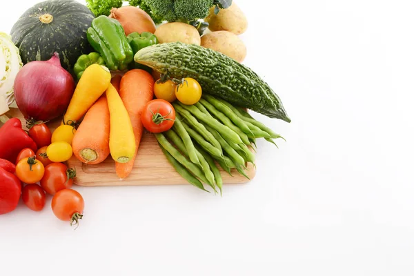 Mixed fresh vegetables on white background