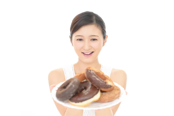 Happy Young Woman Eating Sweets — Stock Photo, Image