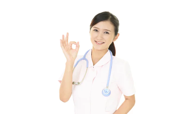 Lächelnde Krankenschwester Mit Handzeichen — Stockfoto