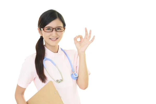 微笑的女护士与 手标志 — 图库照片