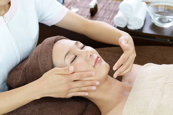 Beautiful Young Woman Receiving Facial Massage Closed Eyes Spa Salon — Stock Photo, Image