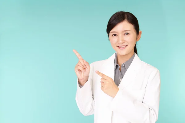 Asian Pharmacist Pointing Her Fingers — Stock Photo, Image