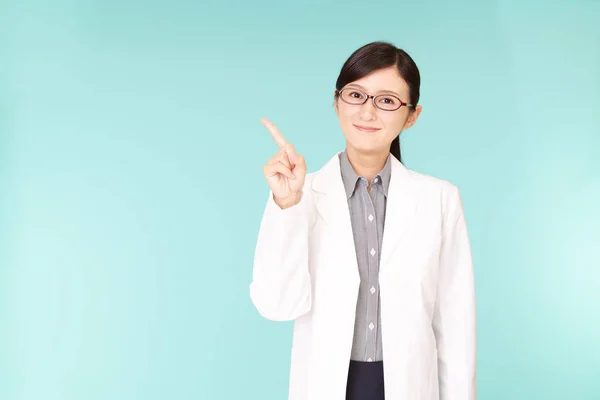 Asian pharmacist pointing with her finger