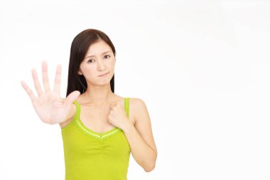 Picture of young woman making stop gesture clipart