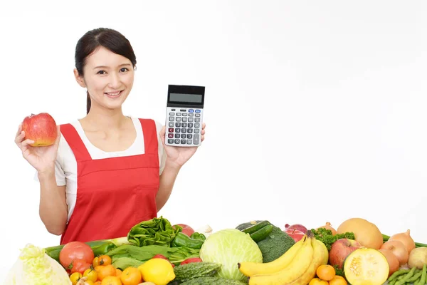 Smiling Asian Housewife Calculator — Stock Photo, Image
