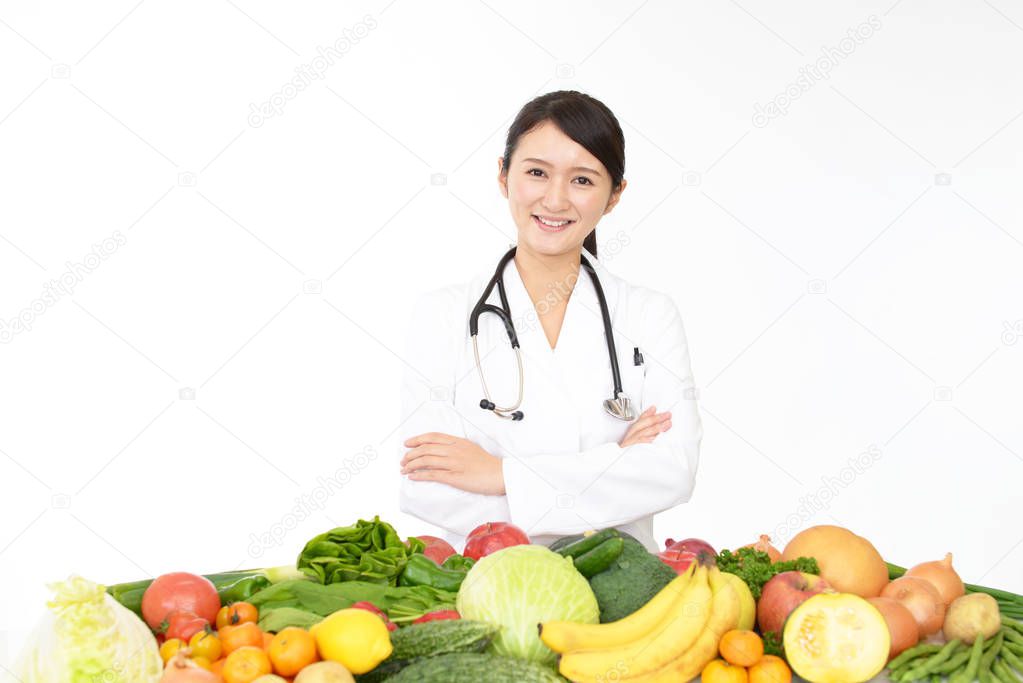 Picture of medical doctor with fruits and vegetables