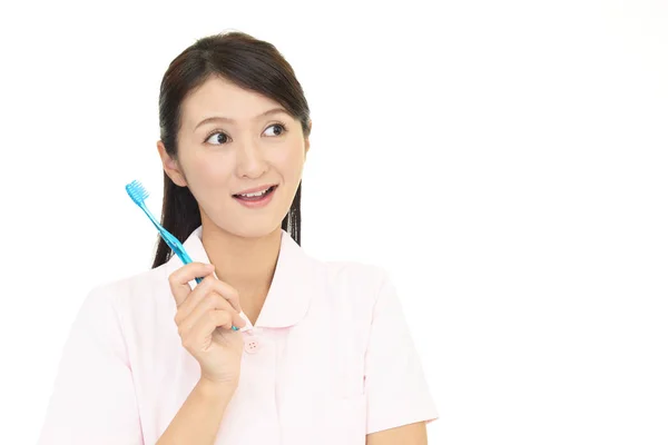 Higienista Dental Sonriente Con Cepillo Dientes —  Fotos de Stock