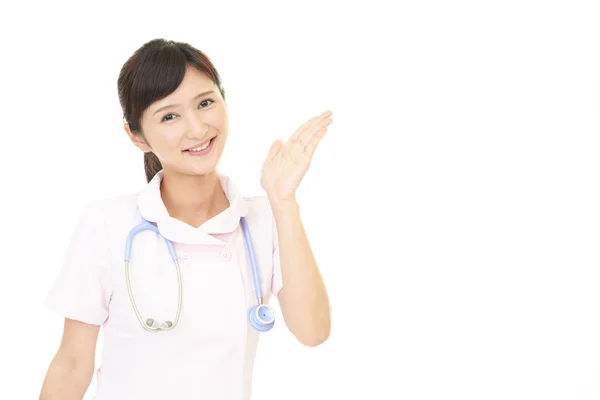 Female Nurse Shows Way — Stock Photo, Image