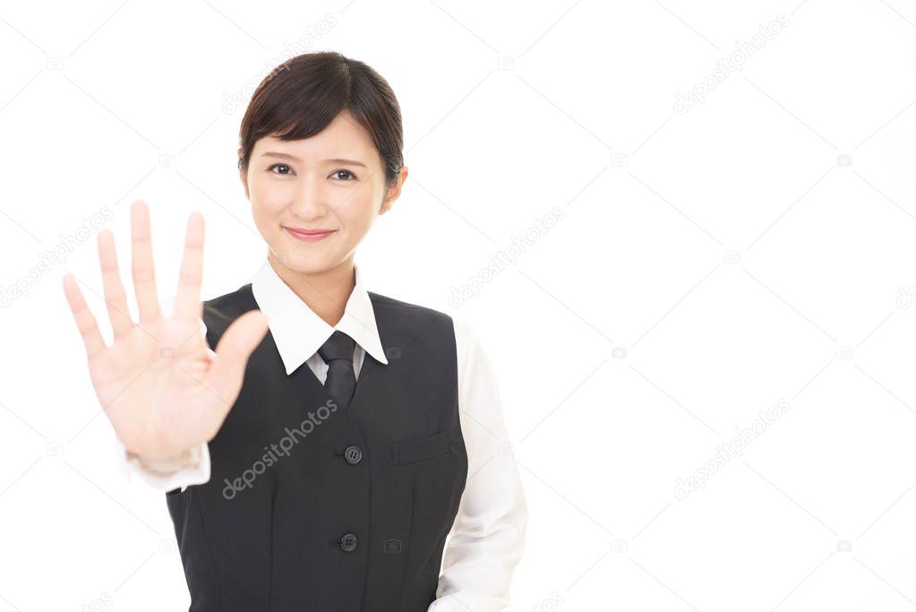 Young business woman making stop gesture