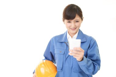 Female worker with a smart phone